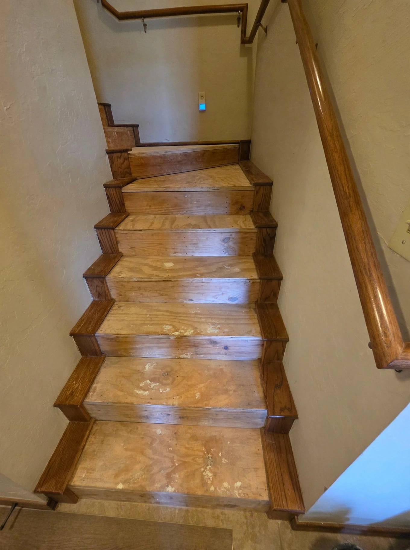 Stripped staircase subfloor before installation